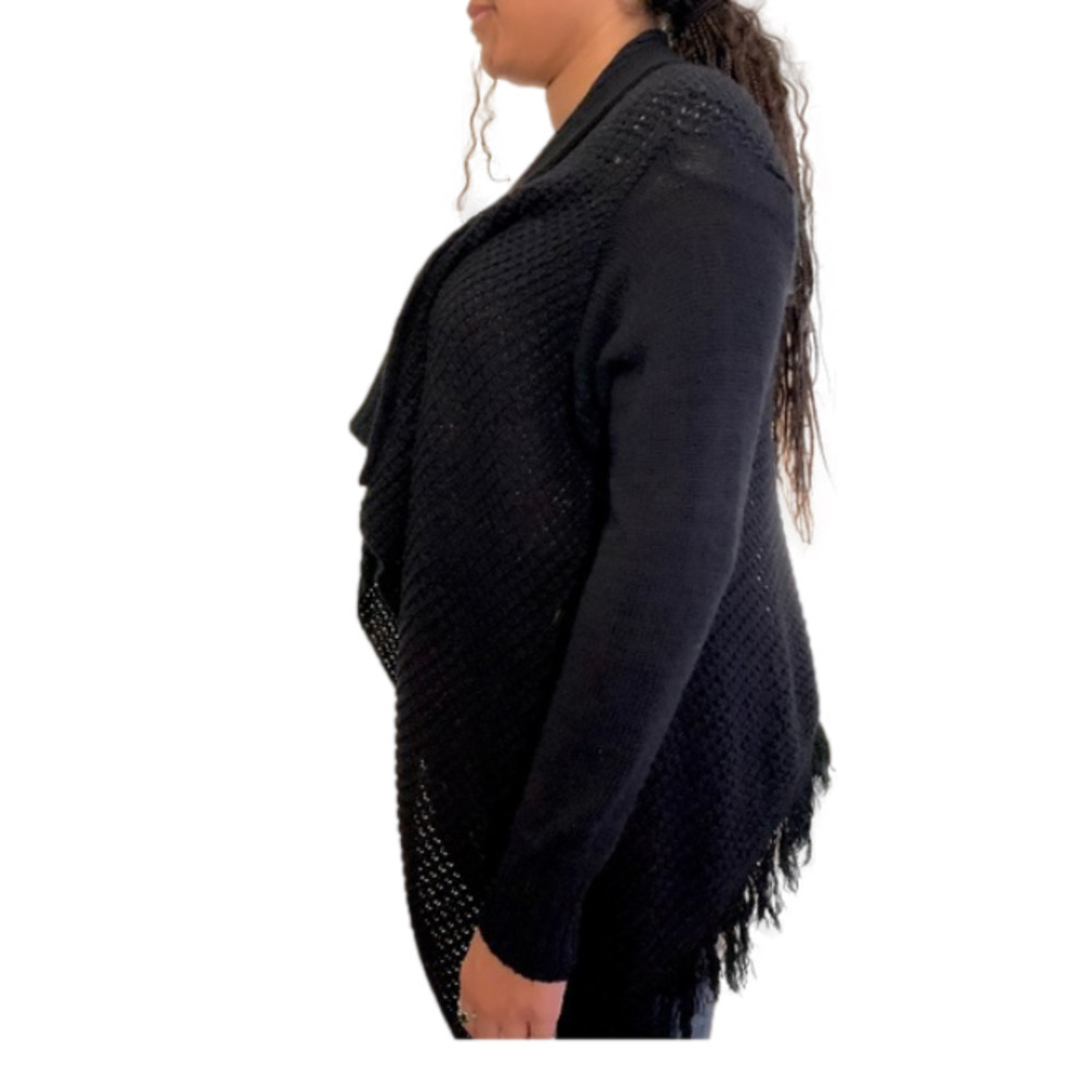 Black knit sweater with frayed edges